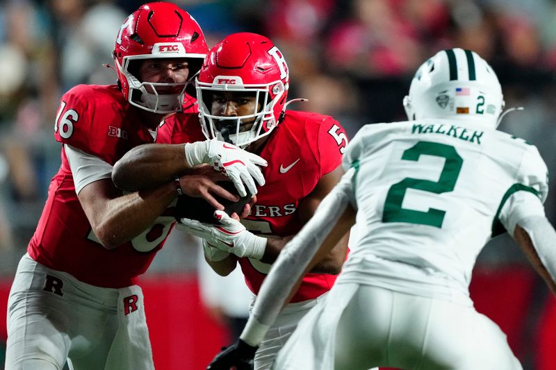 DUPLICATE***Rutgers Scarlet Knights quarterback Athan Kaliakmanis (16) makes it difficult for Ohio Bobcats safety DJ Walker (2) to know whether or not the ball will be handed over to DUPLICATE***Rutgers Scarlet Knights running back CJ Campbell Jr. (5), Thursday, August 28, 2025, in Piscataway.