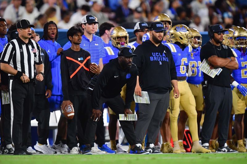 Aug 30, 2025; Pasadena, California, USA; UCLA Bruins head coach DeShaun Foster watches game action against the Utah Utes during the first half at Rose Bowl. Mandatory Credit: Gary A. Vasquez-Imagn Images