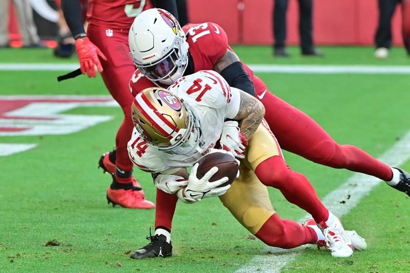 Jan 5, 2025; Glendale, Arizona, USA; San Francisco 49ers wide receiver Ricky Pearsall (14) scores a touchdown while being tackled by Arizona Cardinals cornerback Kei'Trel Clark (13) in the first half at State Farm Stadium. Mandatory Credit: Matt Kartozian-Imagn Images