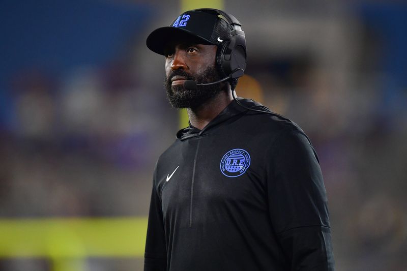 Aug 30, 2025; Pasadena, California, USA; UCLA Bruins head coach DeShaun Foster watches game action against the Utah Utes during the second half at Rose Bowl. Mandatory Credit: Gary A. Vasquez-Imagn Images