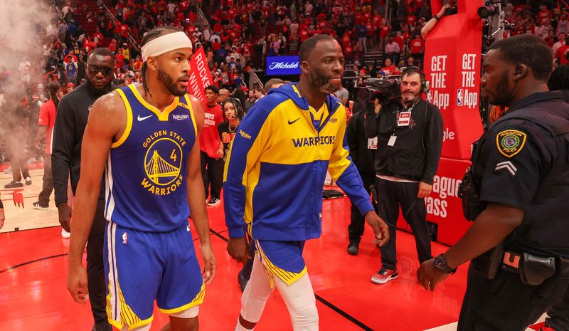 Apr 30, 2025; Houston, Texas, USA; Golden State Warriors guard Moses Moody (4) and forward Draymond Green (23) walks off the court after loosing to the Houston Rockets in game five of first round for the 2025 NBA Playoffs at Toyota Center. Mandatory Credit: Thomas Shea-Imagn Images