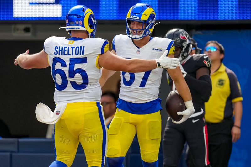Sep 7, 2025; Inglewood, California, USA; Los Angeles Rams center Coleman Shelton (65) and Los Angeles Rams tight end Davis Allen (87) hug during the third quarter at SoFi Stadium. Mandatory Credit: Kirby Lee-Imagn Images