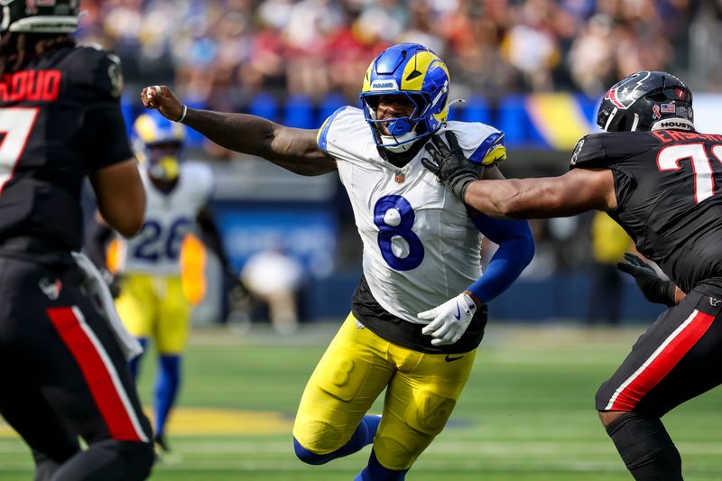 Sep 7, 2025; Inglewood, California, USA; Los Angeles Rams linebacker Jared Verse (8) pressures Houston Texans quarterback C.J. Stroud (7) during the fourth quarter at SoFi Stadium. Mandatory Credit: Kiyoshi Mio-Imagn Images