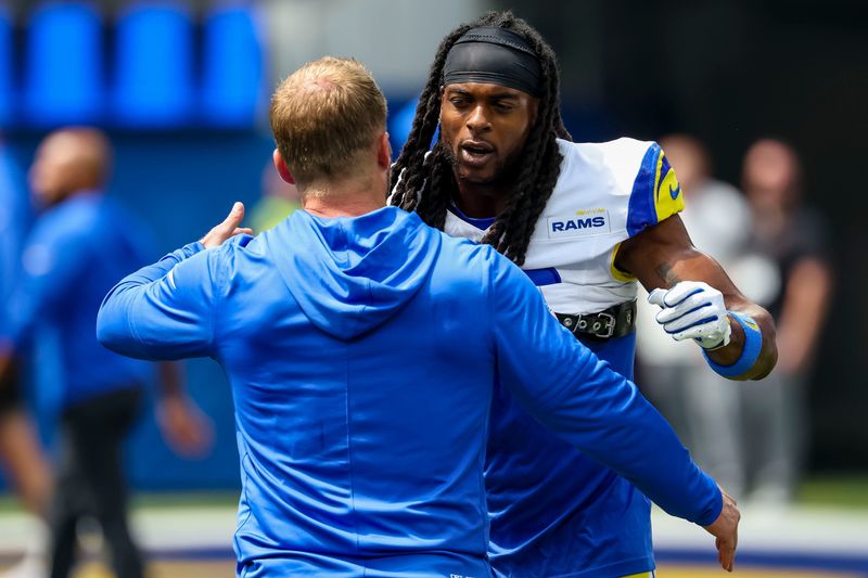 Sep 7, 2025; Inglewood, California, USA; Los Angeles Rams wide receiver Davante Adams (17) hugs coach Sean McVay before the game against the Houston Texans at SoFi Stadium. Mandatory Credit: Kiyoshi Mio-Imagn Images
