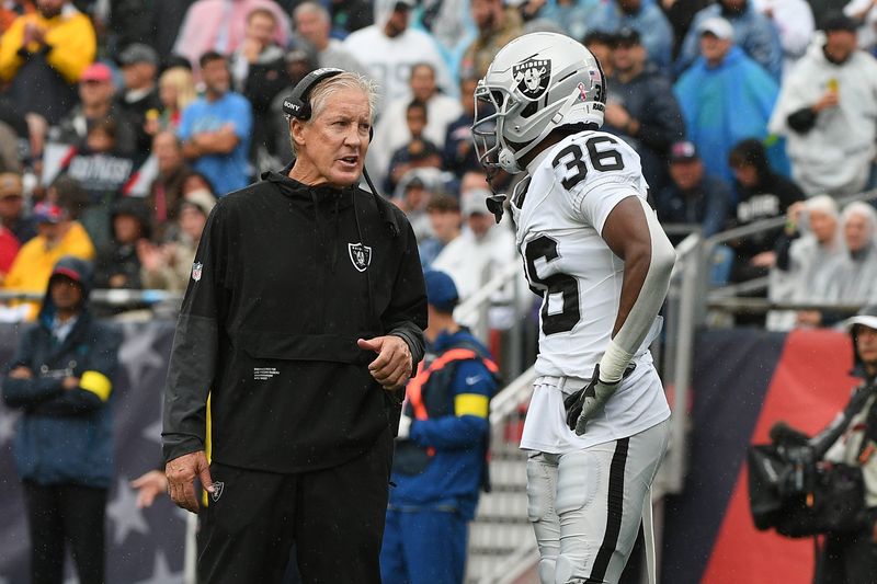 Sep 7, 2025; Foxborough, Massachusetts, USA; Las Vegas Raiders head coach Pete Carroll talks with cornerback Kyu Blu Kelly (36) at Gillette Stadium. Mandatory Credit: Bob DeChiara-Imagn Images