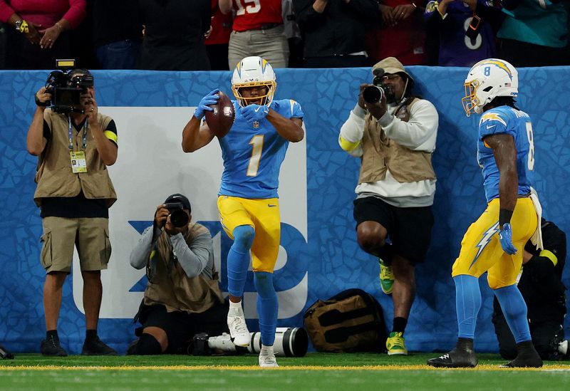 [US, Mexico & Canada customers only] Sep 5, 2025; Sao Paulo, BRAZIL; Los Angeles Chargers wide receiver Quentin Johnston (1) celebrates scoring their first touchdown in the first quarter during a NFL game against the Kansas City Chiefs at Corinthians Arena. Mandatory Credit: Amanda Perobelli/Reuters via Imagn Images
