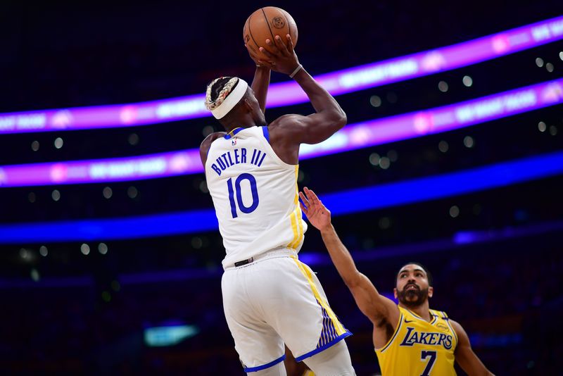 Apr 3, 2025; Los Angeles, California, USA; Golden State Warriors forward Jimmy Butler III (10) shoots against Los Angeles Lakers guard Gabe Vincent (7) during the second half at Crypto.com Arena. Mandatory Credit: Gary A. Vasquez-Imagn Images