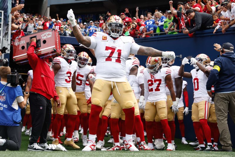 Sep 7, 2025; Seattle, Washington, USA; San Francisco 49ers offensive tackle Trent Williams (71) dances outside the locker room before player introductions against the Seattle Seahawks at Lumen Field. Mandatory Credit: Joe Nicholson-Imagn Images
