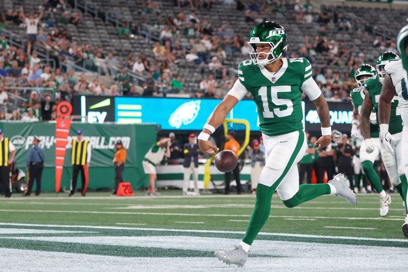 Aug 22, 2025; East Rutherford, New Jersey, USA; New York Jets quarterback Adrian Martinez (15) rushed for a touchdown during the second half against the Philadelphia Eagles at MetLife Stadium. Mandatory Credit: Vincent Carchietta-Imagn Images