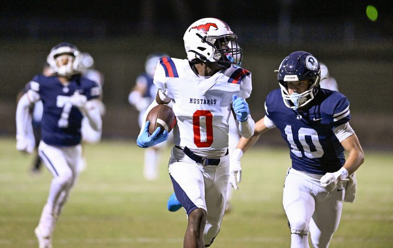Tulare Western's Amarion Taylor stays ahead of Redwood's Brody Preisendorf in non-league high school football Friday, September 12, 2025.