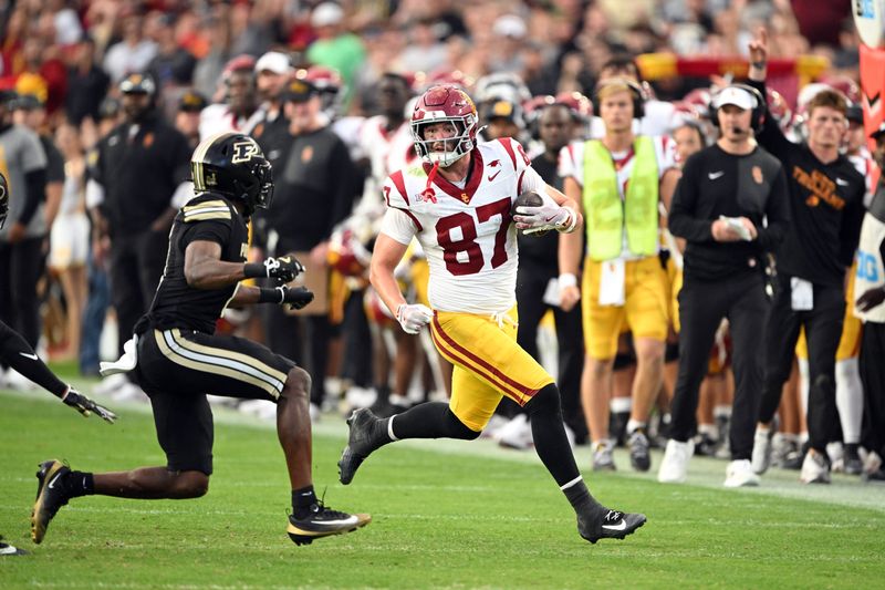 Sep 13, 2025; West Lafayette, Indiana, USA; USC Trojans tight end Lake McRee (87) looks to get past Purdue Boilermakers defensive back Tony Grimes (0) during the second quarter at Ross-Ade Stadium. Mandatory Credit: Marc Lebryk-Imagn Images