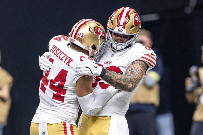 Sep 14, 2025; New Orleans, Louisiana, USA; San Francisco 49ers fullback Kyle Juszczyk (44) and tight end Luke Farrell (89) celebrate a touchdown against the New Orleans Saints during the first half at Caesars Superdome. Mandatory Credit: Stephen Lew-Imagn Images