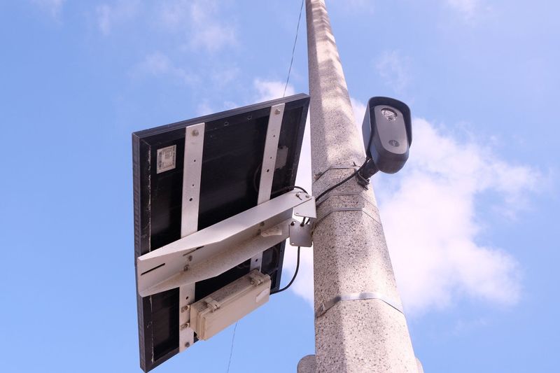 A Flock Safety-branded license plate reader camera site on a lamppost near the intersection of Peacock Drive and Bristol Road in Ventura on Sept. 9, 2025.