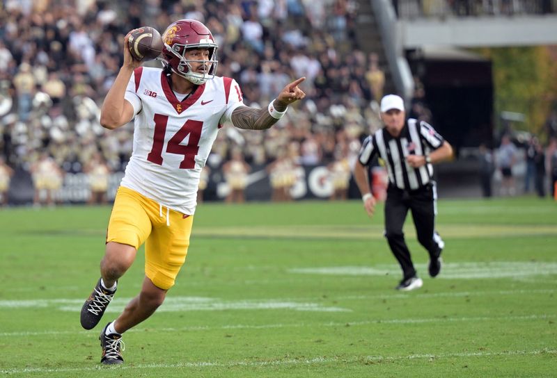 Sep 13, 2025; West Lafayette, Indiana, USA; Southern California Trojans quarterback Jayden Maiava (14) points during a play during the first quarter against the Purdue Boilermakers at Ross-Ade Stadium. Mandatory Credit: Marc Lebryk-Imagn Images