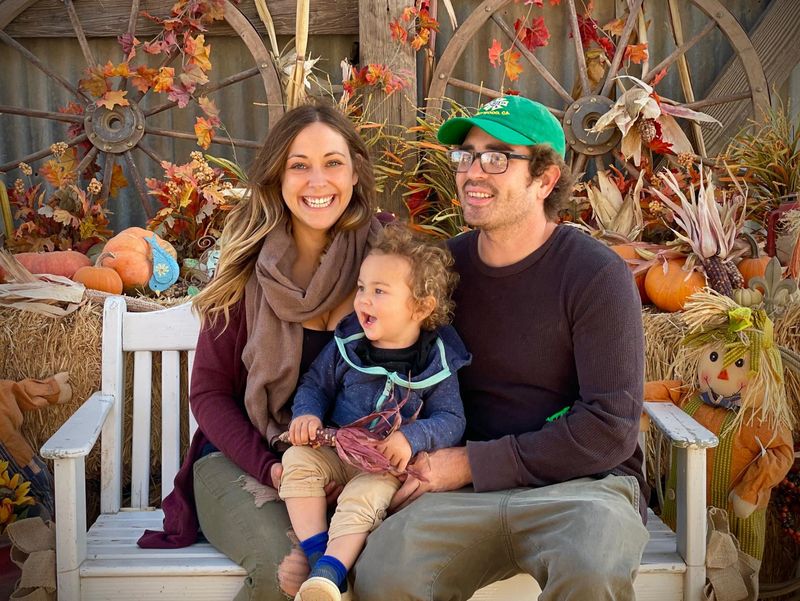Maxwell Haworth, center, smiles in a family photo with his parents Chrissy Carmack and Mikey Haworth. Max, 5, died Aug. 31 after falling from the rocks at the beach near Rincon Point.
