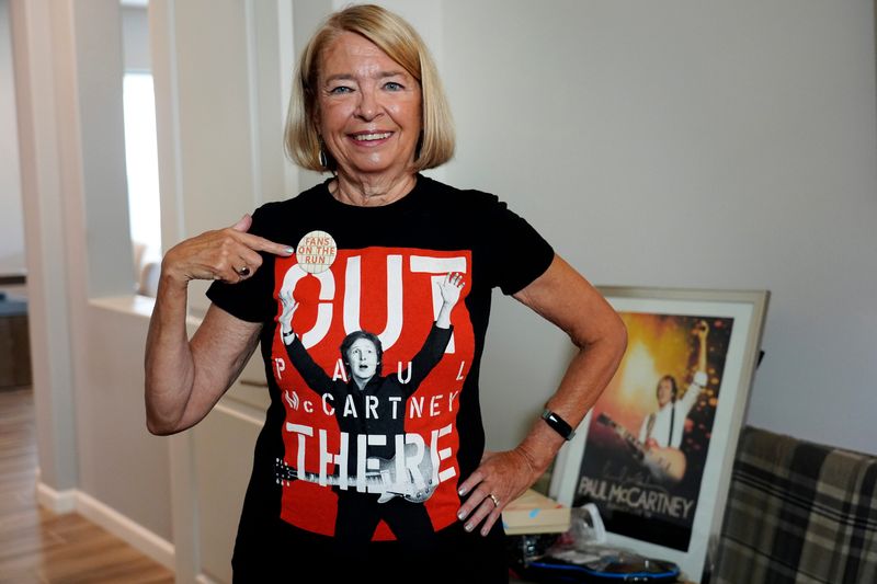 Linda Harger points to her Fans on the Run button at her home in Indio, Calif., on Sept. 11, 2025.