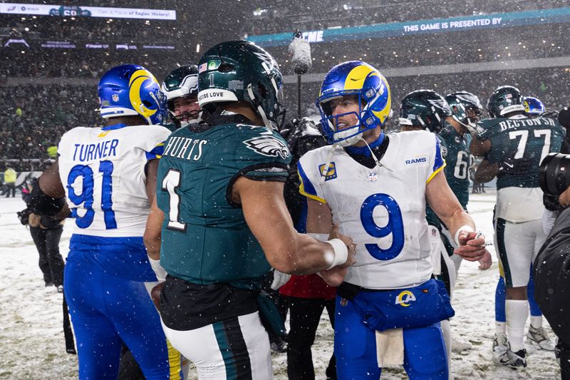 Jan 19, 2025; Philadelphia, Pennsylvania, USA; Philadelphia Eagles quarterback Jalen Hurts (1) and Los Angeles Rams quarterback Matthew Stafford (9) shake hands after a 2025 NFC divisional round game at Lincoln Financial Field. Mandatory Credit: Bill Streicher-Imagn Images