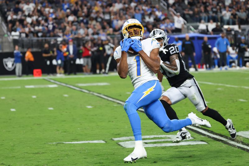 Sep 15, 2025; Paradise, Nevada, USA; Los Angeles Chargers wide receiver Quentin Johnston (1) makes a catch during the second quarter against the Las Vegas Raiders at Allegiant Stadium. Mandatory Credit: Kiyoshi Mio-Imagn Images