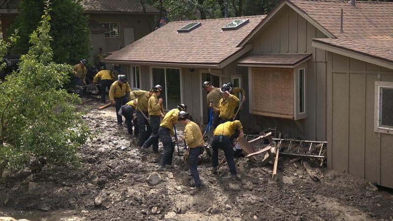 Firefighters work to clear mud and debris in Forest Falls on Friday, Sept. 19, 2025, following a massive storm and flooding.