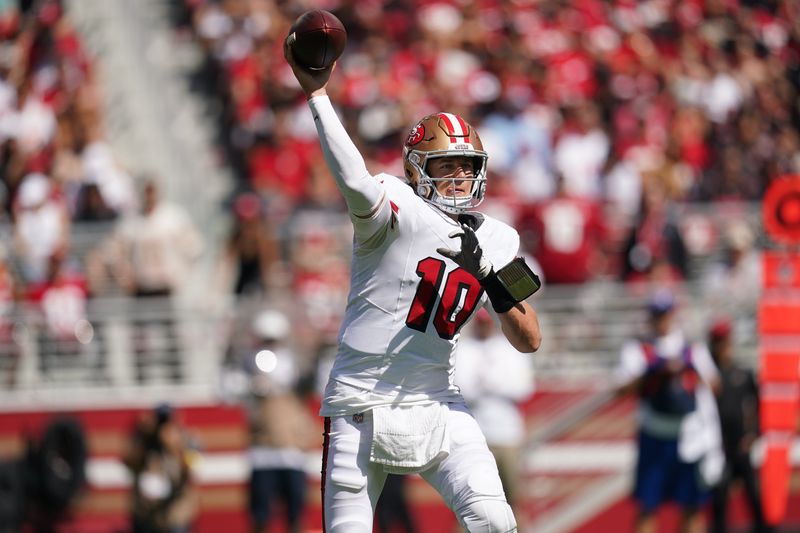 Sep 21, 2025; Santa Clara, California, USA; San Francisco 49ers quarterback Mac Jones (10) throws the ball against the Arizona Cardinals during the first half at Levi's Stadium. Mandatory Credit: Cary Edmondson-Imagn Images