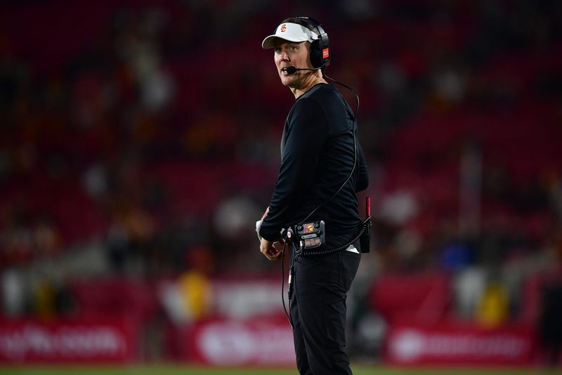 Sep 20, 2025; Los Angeles, California, USA; Southern California Trojans head coach Lincoln Riley watches game action against the Michigan State Spartans during the second half at the Los Angeles Memorial Coliseum. Mandatory Credit: Gary A. Vasquez-Imagn Images