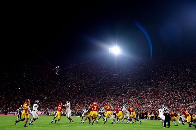 Sep 20, 2025; Los Angeles, California, USA; Michigan State Spartans running back Makhi Frazier (5) runs the ball against the Southern California Trojans during the second half at the Los Angeles Memorial Coliseum. Mandatory Credit: Gary A. Vasquez-Imagn Images