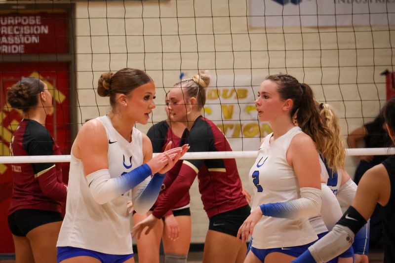 U-Prep's Audrey Berg (left) and Kaydence Bausell (right) talk during a game against West Valley on Sept. 23, 2025.