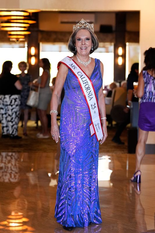 Ms. Senior California 2025 Holli Kenley, of Rancho Mirage, mingles with attendees before speaking at the Rancho Mirage Women’s Club luncheon at Chaparral Country Club in Palm Desert, Calif., on Thursday, Sept. 25, 2025. She will compete in the national competition at the beginning of October.