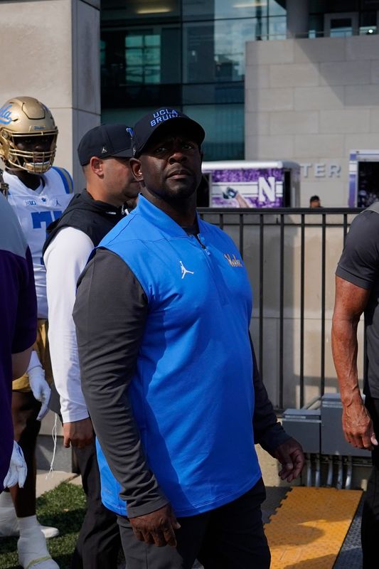 Sep 27, 2025; Evanston, Illinois, USA; UCLA Bruins interim head coach Tim Skipper takes the field against the Northwestern Wildcats during the first half at Northwestern Medicine Field at Martin Stadium. Mandatory Credit: David Banks-Imagn Images