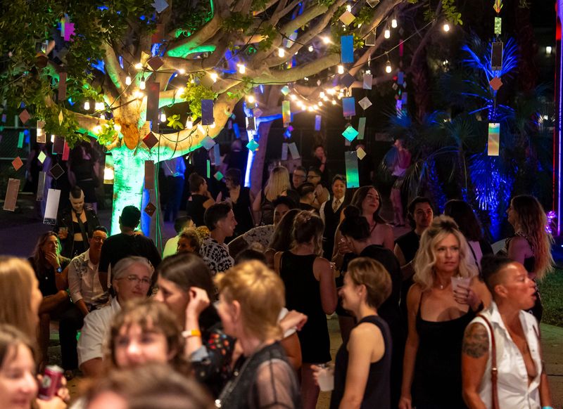 Festivalgoers mingle in an atrium space outside of The Dinah's Black & White Ball at the Riviera Resort in Palm Springs, Calif., Friday, Sept. 26, 2025.