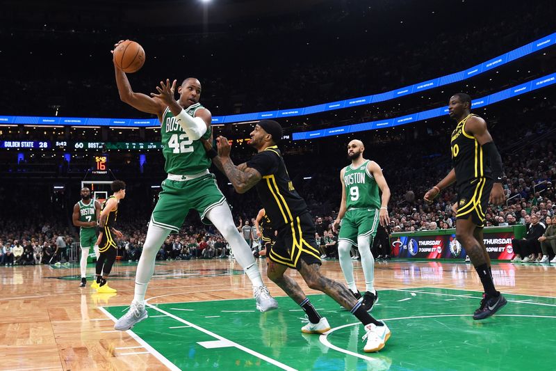 Mar 3, 2024; Boston, Massachusetts, USA; Boston Celtics center Al Horford (42) controls the ball while Golden State Warriors guard Gary Payton II (0) defends during the first half at TD Garden. Mandatory Credit: Bob DeChiara-USA TODAY Sports