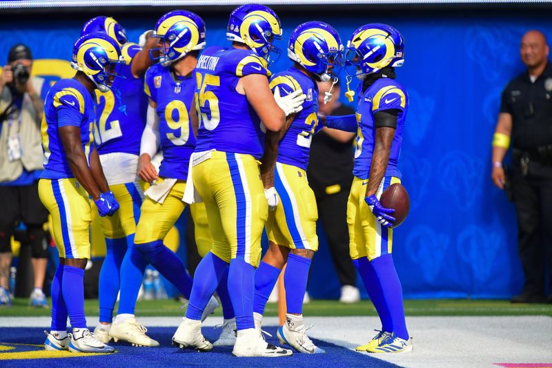 Sep 28, 2025; Inglewood, California, USA; Los Angeles Rams wide receiver Tutu Atwell (5) celebrates his touchdown scored against the Indianapolis Colts with running back Kyren Williams (23) and center Coleman Shelton (65) during the second half at SoFi Stadium. Mandatory Credit: Gary A. Vasquez-Imagn Images