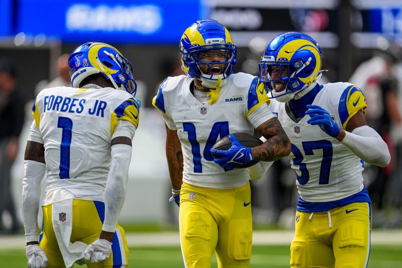 Sep 7, 2025; Inglewood, California, USA; Los Angeles Rams cornerback Cobie Durant (14) reacts with teammates during the third quarter at SoFi Stadium. Mandatory Credit: Kirby Lee-Imagn Images