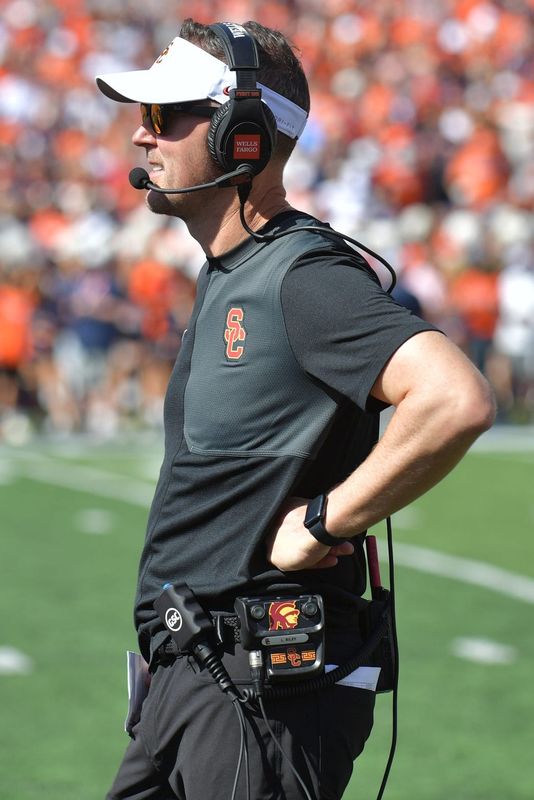 Sep 27, 2025; Champaign, Illinois, USA; Southern California Trojans head coach Lincoln Riley on the sidelines during the first half against the Illinois Fighting Illini at Memorial Stadium. Mandatory Credit: Ron Johnson-Imagn Images