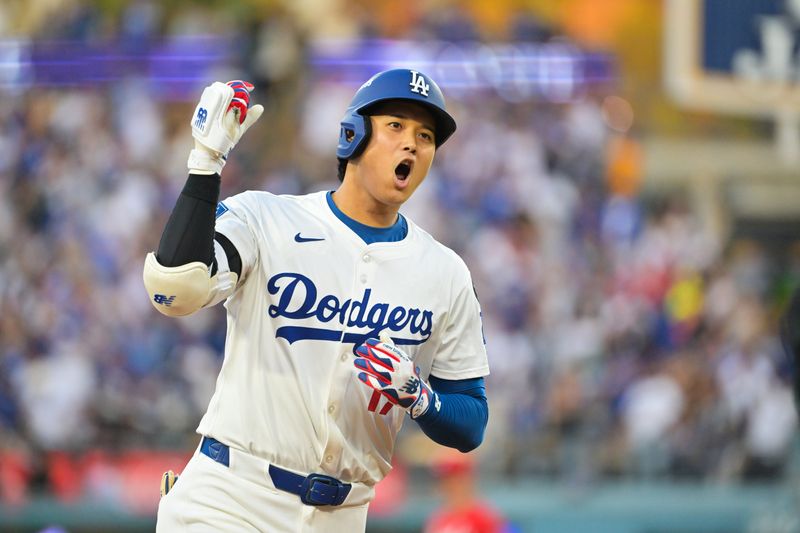 Sep 30, 2025; Los Angeles, California, USA; Los Angeles Dodgers designated hitter Shohei Ohtani (17) celebrates after hitting a home run during the first inning against the Cincinnati Reds during game one of the Wildcard round for the 2025 MLB playoffs at Dodger Stadium. Mandatory Credit: Jayne Kamin-Oncea-Imagn Images