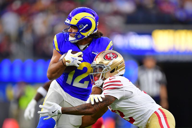 Oct 2, 2025; Inglewood, California, USA; Los Angeles Rams wide receiver Puka Nacua (12) makes a catch against the San Francisco 49ers during the first half at SoFi Stadium. Mandatory Credit: Gary A. Vasquez-Imagn Images