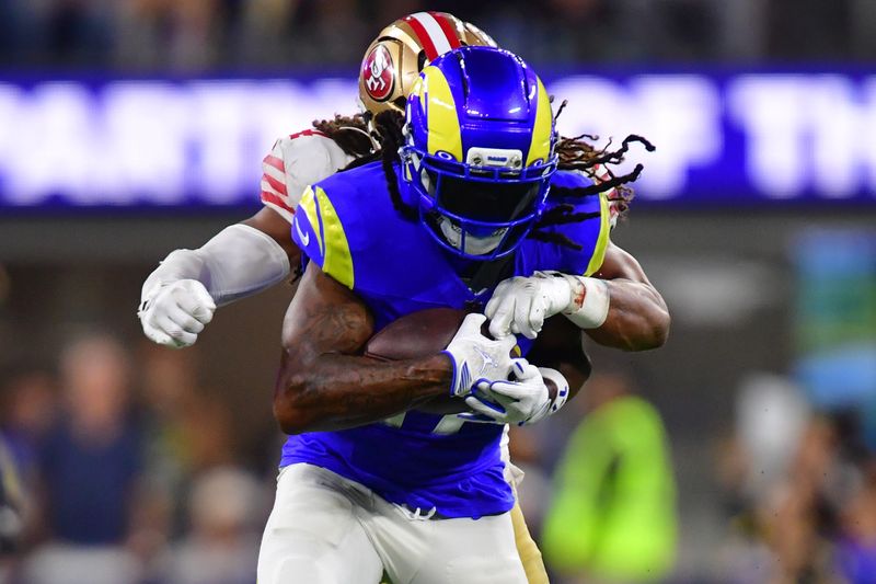 Oct 2, 2025; Inglewood, California, USA; Los Angeles Rams wide receiver Davante Adams (17) makes a catch against the San Francisco 49ers during the second half at SoFi Stadium. Mandatory Credit: Gary A. Vasquez-Imagn Images