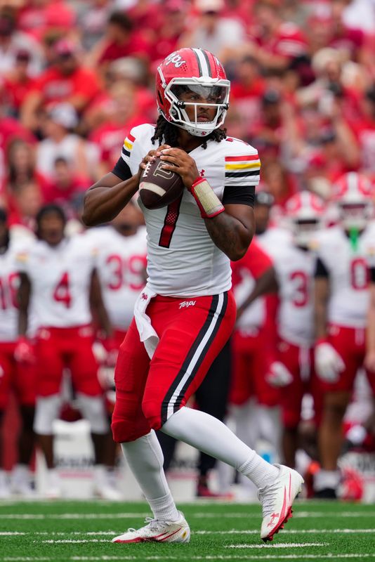 Sep 20, 2025; Madison, Wisconsin, USA; Maryland Terrapins quarterback Malik Washington (7) looks to throw a pass during the game against the Wisconsin Badgers at Camp Randall Stadium. Mandatory Credit: Jeff Hanisch-Imagn Images