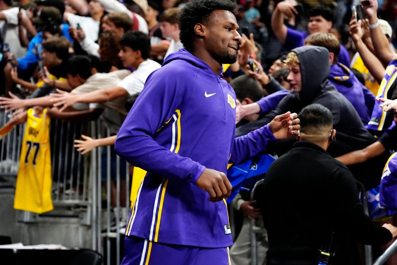 Lakers guard Bronny James (9) enters the court prior to the start of the preseason game against the Phoenix Suns at Acrisure Arena in Palm Desert, Calif., on Friday, Oct. 3, 2025.