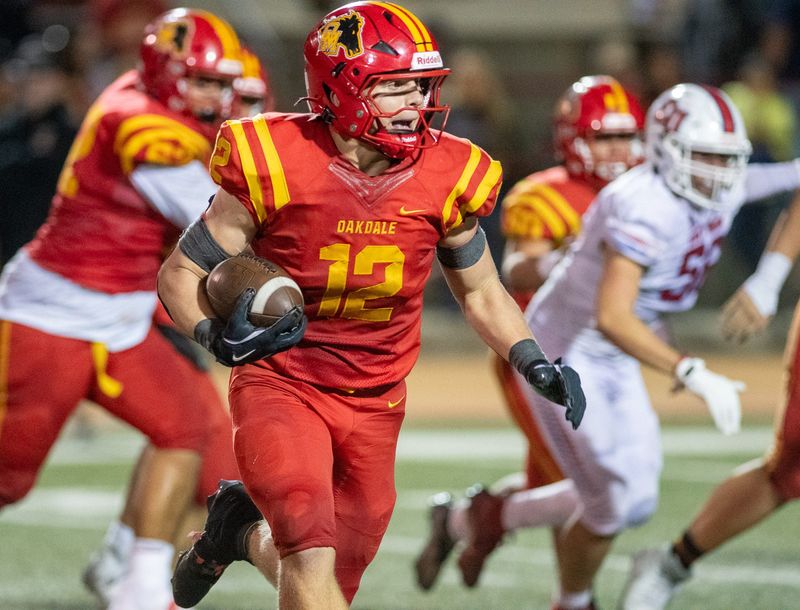 Oakdale High’s Wes Burford on a TD run against East Union High from Manteca Friday night. Oakdale won 71-55.