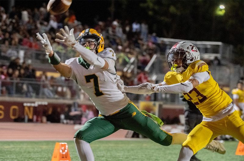 Tracy’s David Goularte, left, reaches for a pass past Edison’s Antwone Beattie during a varsity football game at Edison’s Magnasco Stadium in Stockton on Oct. 3 2025. The pass was incomplete.