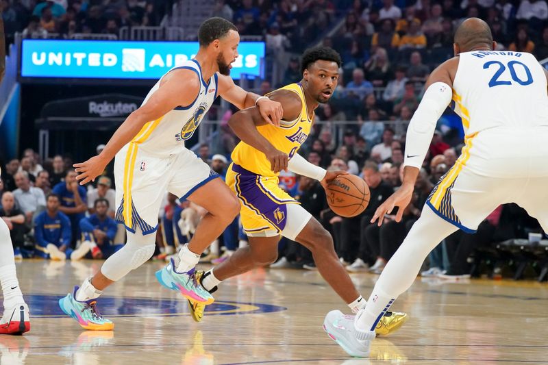 Oct 5, 2025; San Francisco, California, USA; Los Angeles Lakers guard Bronny James (9) dribbles upcourt against Golden State Warriors guard Stephen Curry (30) in the first quarter at Chase Center. Mandatory Credit: David Gonzales-Imagn Images