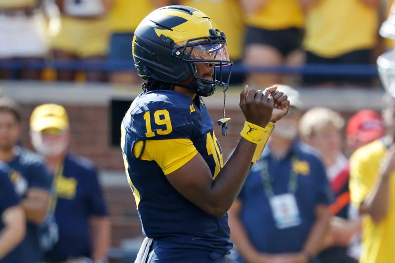 Oct 4, 2025; Ann Arbor, Michigan, USA; Michigan Wolverines quarterback Bryce Underwood (19) celebrates in the second half against the Wisconsin Badgers at Michigan Stadium. Mandatory Credit: Rick Osentoski-Imagn Images