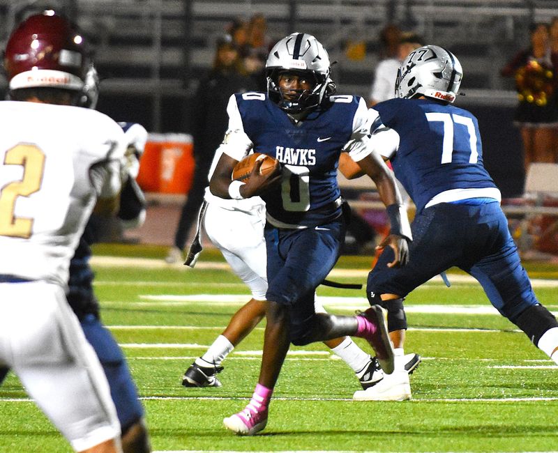 Silverado quarterback Brent Hubbard runs the ball against Adelanto on Thursday, Oct. 9, 2025. Silverado beat Adelanto 23-10 to begin Desert Sky League action.