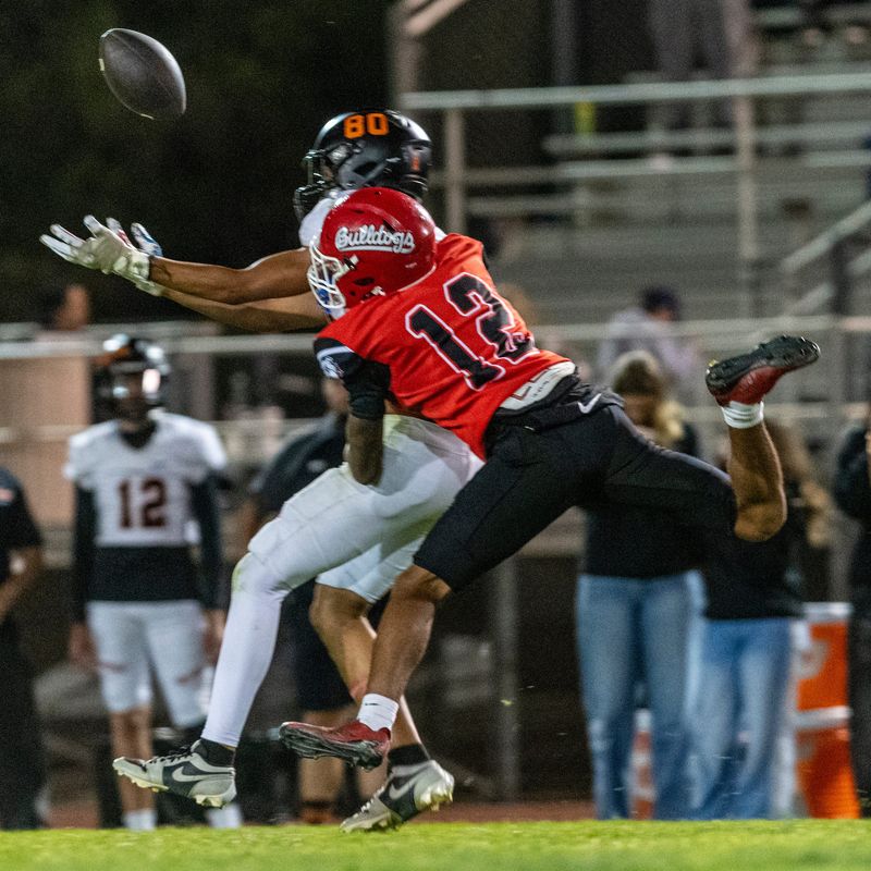 Oak Hills’ Royalton Allen breaks up a pass intended for Apple Valley’s Davion Swan during the second half on Friday, Oct. 10, 2025. Oak Hills beat Apple Valley 42-21 and improved to 2-0 in league play.