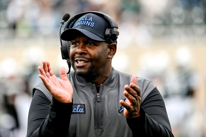 UCLA's interim head coach Tim Skipper celebrates after a Bruins touchdown against Michigan State during the third quarter on Saturday, Oct. 11, 2025, at Spartan Stadium in East Lansing.