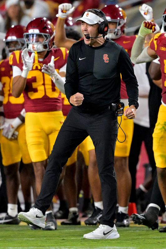 Oct 11, 2025; Los Angeles, California, USA; USC Trojans head coach Lincoln Riley celebrates after kicker Ryon Sayeri (48) hit a 54-yard field goal in the second half against the Michigan Wolverines at United Airlines Field at the Los Angeles Memorial Coliseum. Mandatory Credit: Jayne Kamin-Oncea-Imagn Images