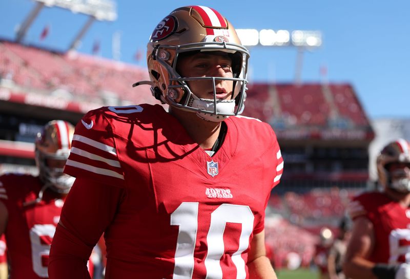 Oct 12, 2025; Tampa, Florida, USA; San Francisco 49ers quarterback Mac Jones (10) takes the field prior to a game against the Tampa Bay Buccaneers at Raymond James Stadium. Mandatory Credit: Nathan Ray Seebeck-Imagn Images