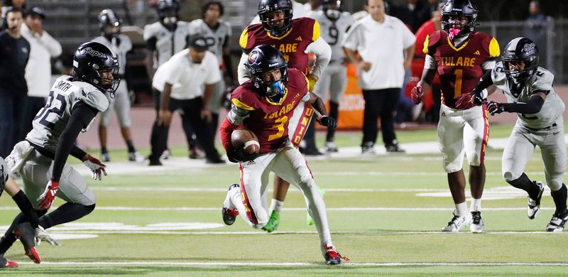 Tulare Union's Demaje Riley on a pass catch against Hanford during their West Yosemite League high school football game Bob Mathias Stadium in Tulare, Calif., Friday, Oct. 10, 2025.
