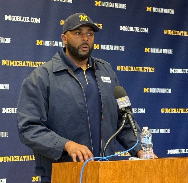 Sherrone Moore wearing his blue collar jacket to Schembechler Hall for his news conference Monday, Oct. 13, 2025.